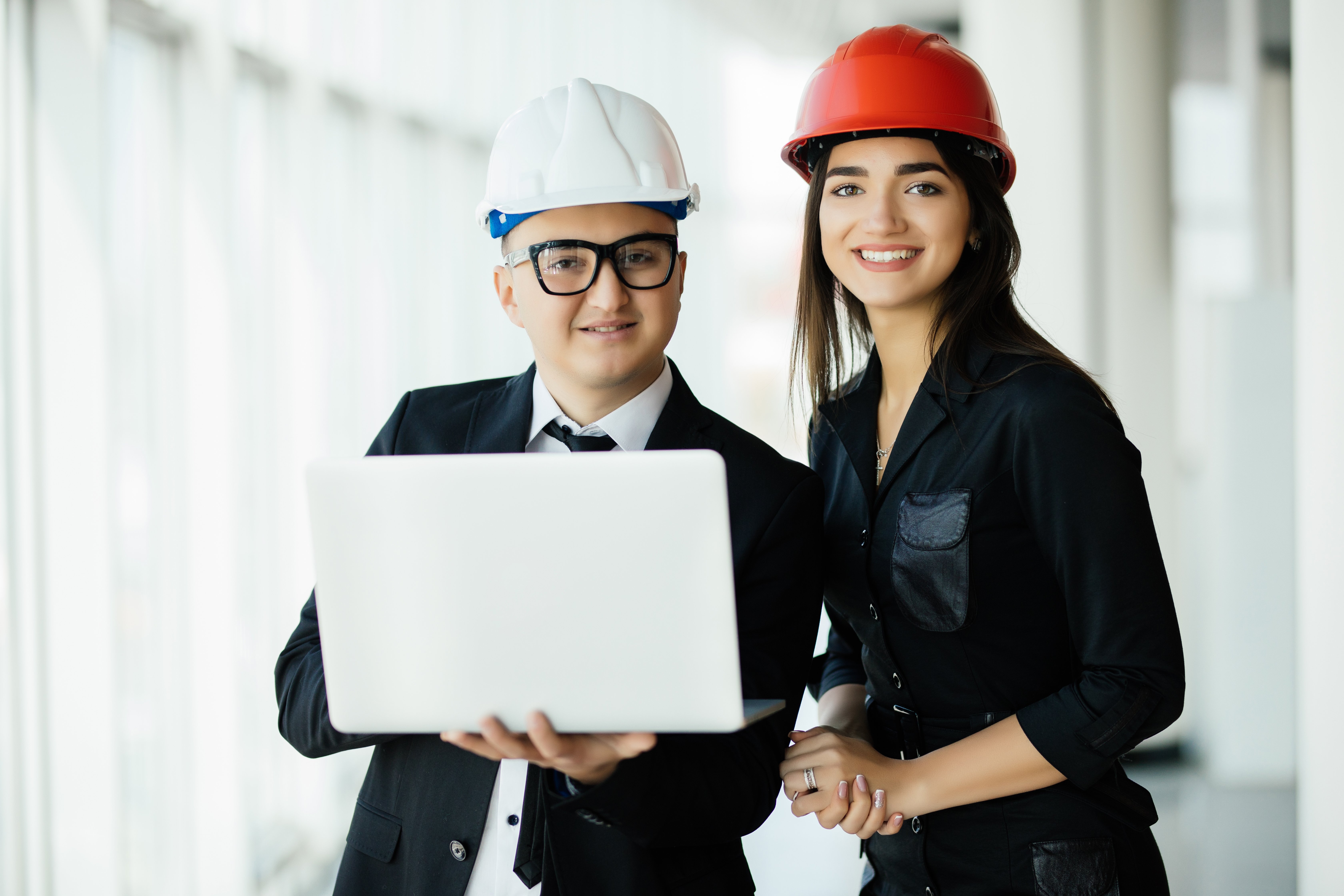 engineering-and-architecture-concept-engineers-working-on-building-site-holding-laptop-architect-man-working-with-engineer-woman-inspection-in-workplace-for-architectural-plan engineering-and-architecture-concept-engineers-working-on-building-site-holding-laptop-architect-man-working-with-engineer-woman-inspection-in-workplace-for-architectural-plan